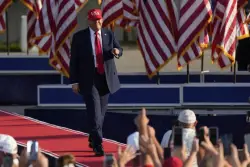 Trump signs his tax and spending cut bill at the White House July 4 picnic