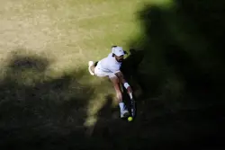 A tip of the cap to the Wimbledon player who caught his hat when it fell off but still won a point