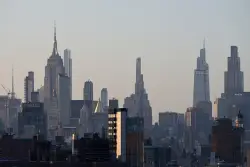 At least 2 people shot at Manhattan office building housing financial firms and NFL, AP source says