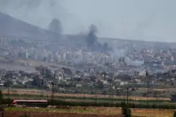 Israel strikes in Damascus as clashes between government forces and Druze groups in Syria rage on